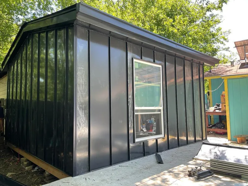 Black standing seam metal wall panels for Roof Inspection in Sarasota Springs