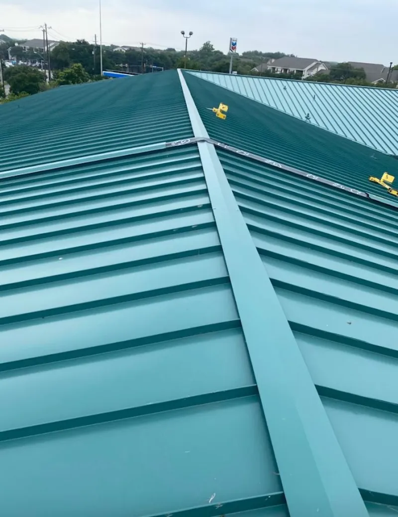 Green commercial metal roof ridge and valley for Metal Roof Repair in Sarasota Springs